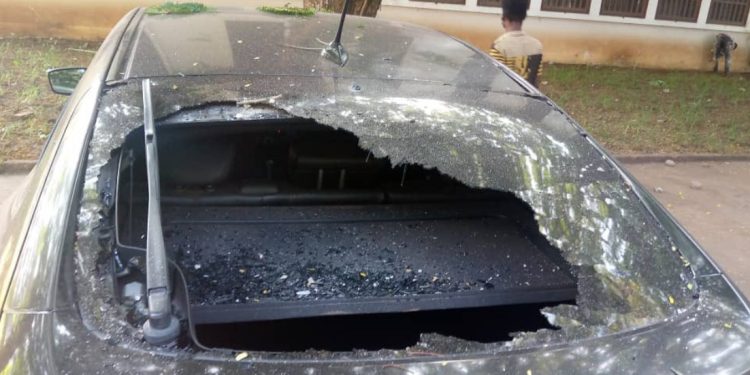 vandalized car as a result of the riot in UG
