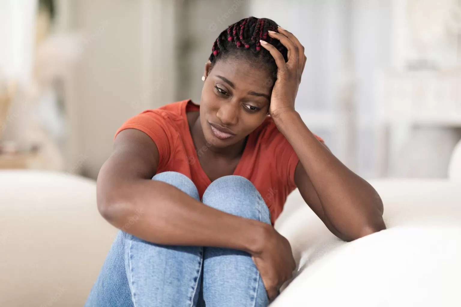 portrait depressed young black woman sitting couch home 116547 40376 1536x1024 1 jpg
